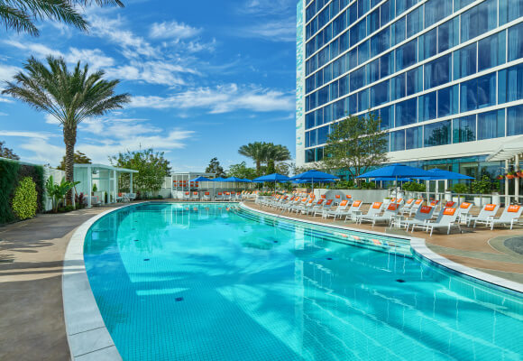 Pool with Chairs and Umbrellas