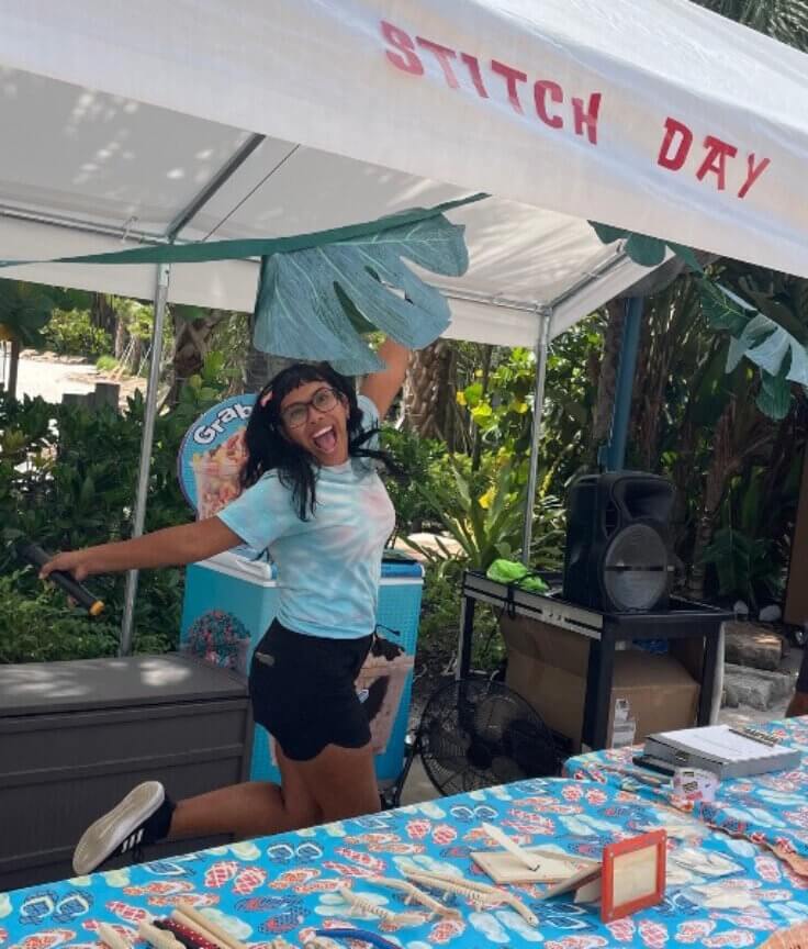 Camp Dolphin instructor jumping for joy