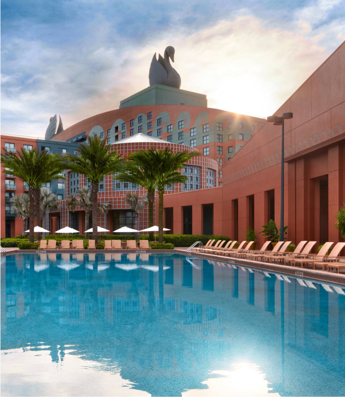 Swimming Pool with Chairs and Umbrellas at the Walt Disney World Swan Resort