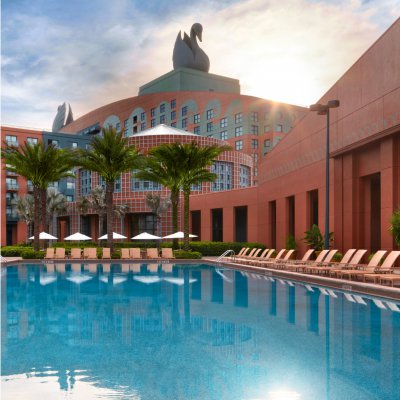 Swimming Pool with Chairs and Umbrellas at the Walt Disney World Swan Resort