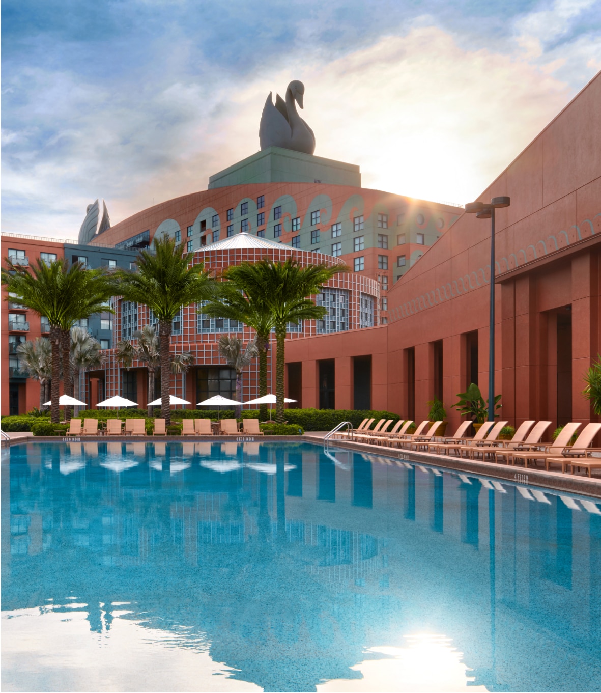 Swimming Pool with Chairs and Umbrellas at the Walt Disney World Swan Resort