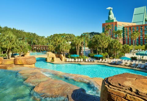 Grotto Pool with Chairs, Umbrellas and Dolphin Hotel in the Background