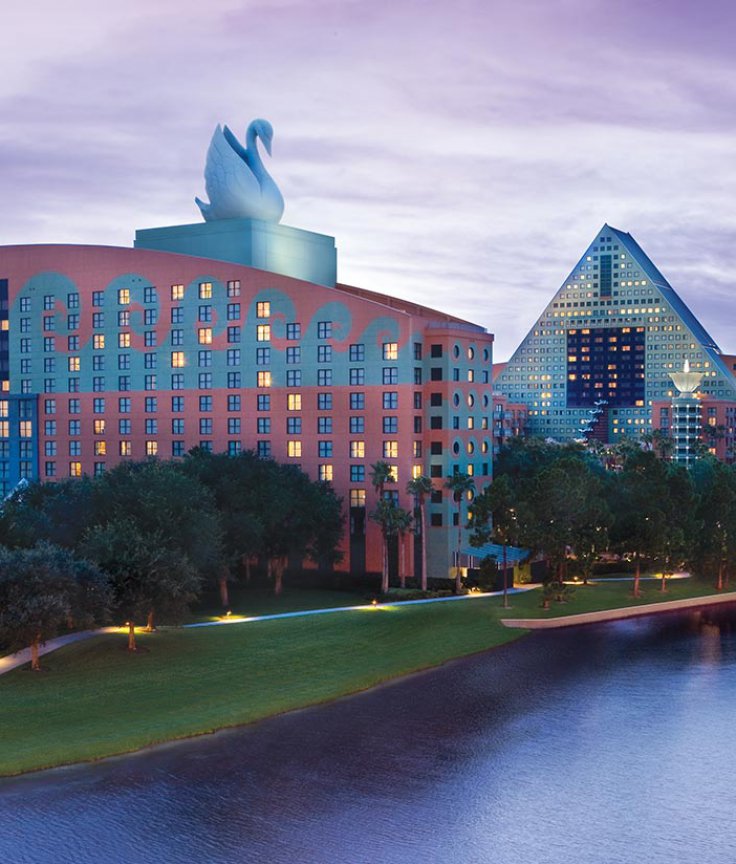 Walt Disney World Swan and Dolphin Resort Exterior View with Boat at Sunset