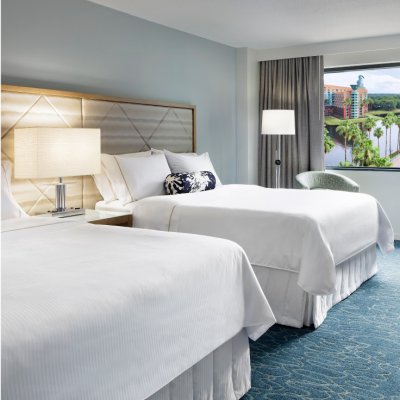 Traditional Queen/Queen Resort View Room with Desk, Chair, Couch an Large TV at the Walt Disney World Swan Dolphin