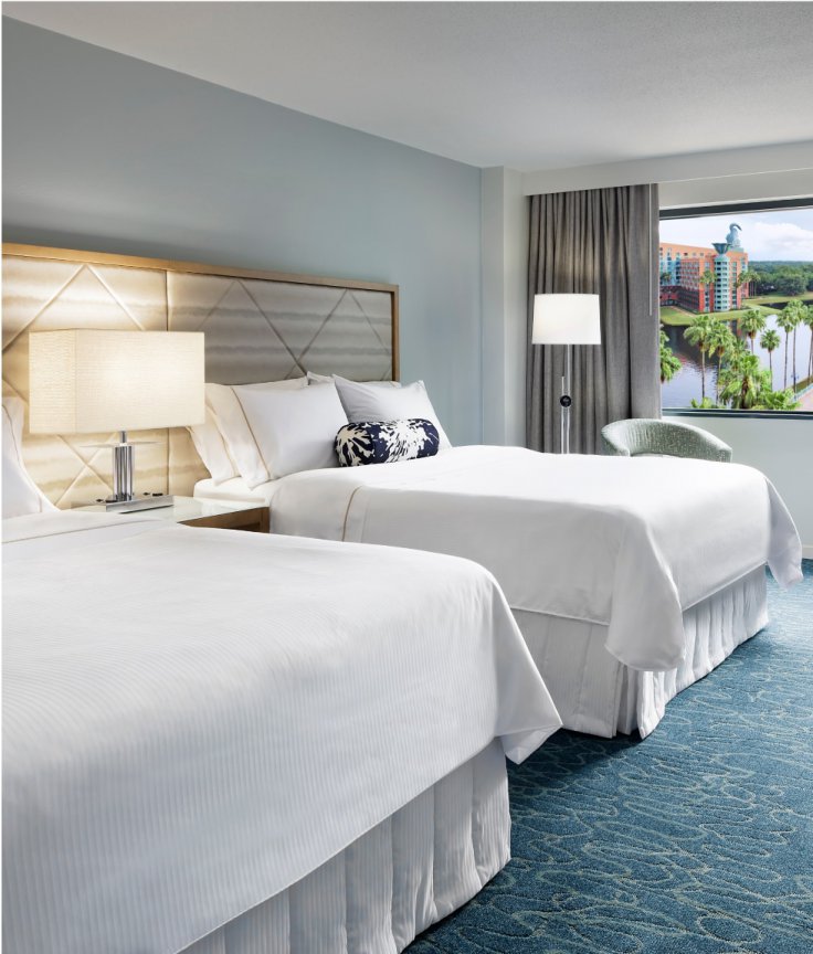 Traditional Queen/Queen Resort View Room with Desk, Chair, Couch an Large TV at the Walt Disney World Swan Dolphin