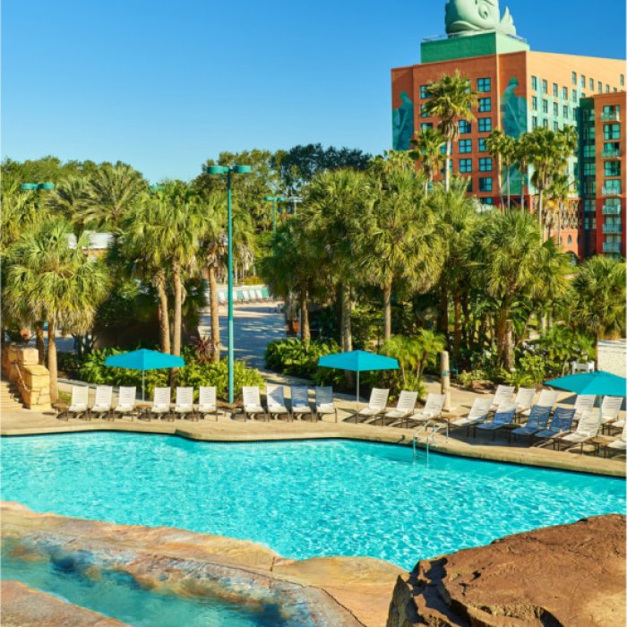 Grotto Pool with Chairs, Umbrellas and Dolphin Hotel in the Background