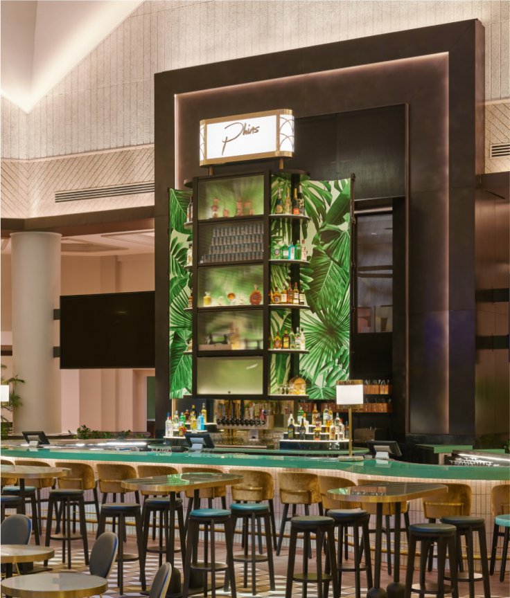 Phins Lounge with Tables, Chairs, Bar and Two Very Large TVs