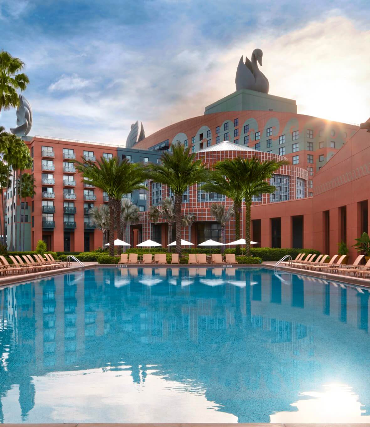 Pool with Chairs, Umbrellas and Palm Trees